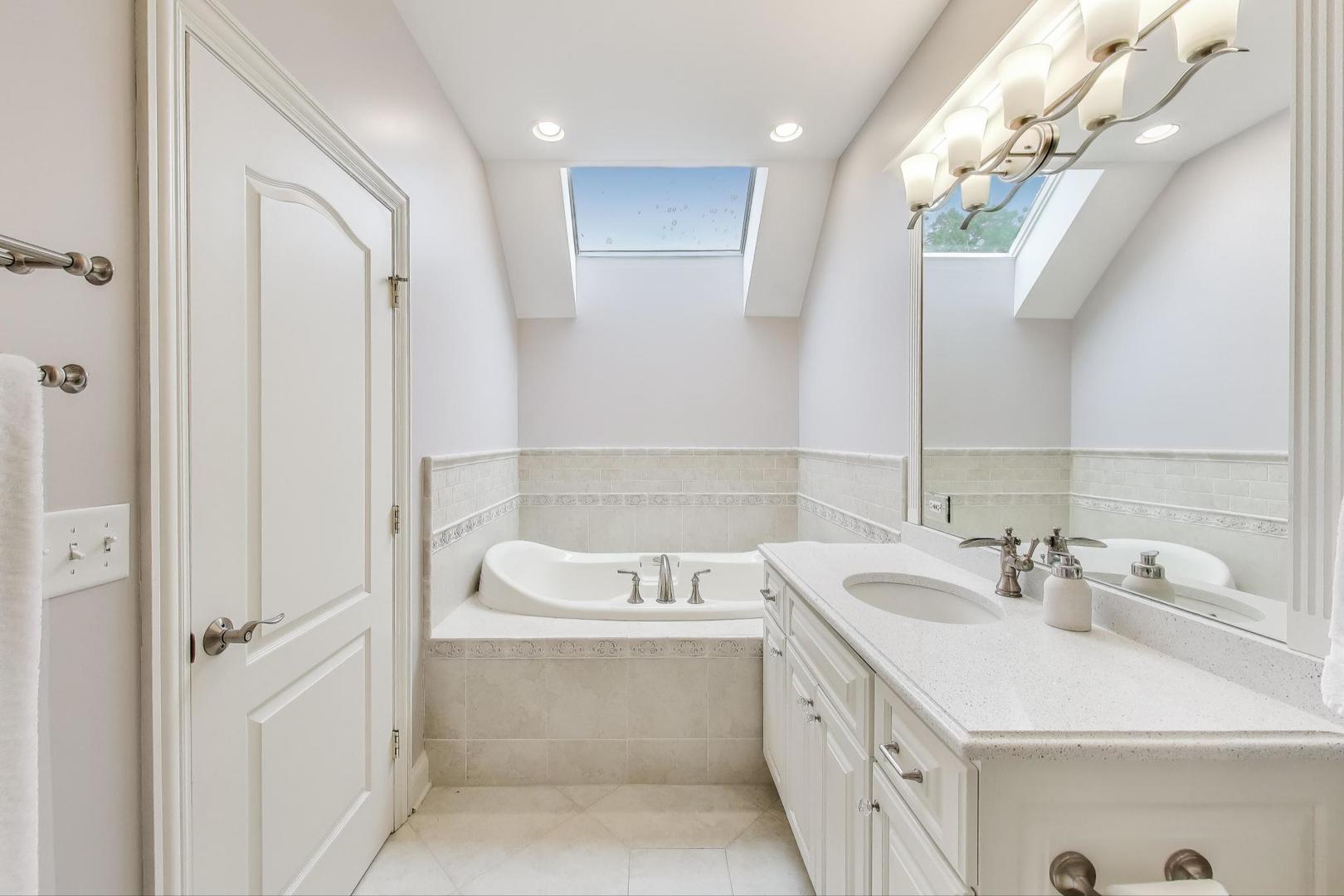 20580 West High Ridge Drive Kildeer, IL 60047 - Photo 42 of 69 a bathroom with a sink a vanity and a mirror