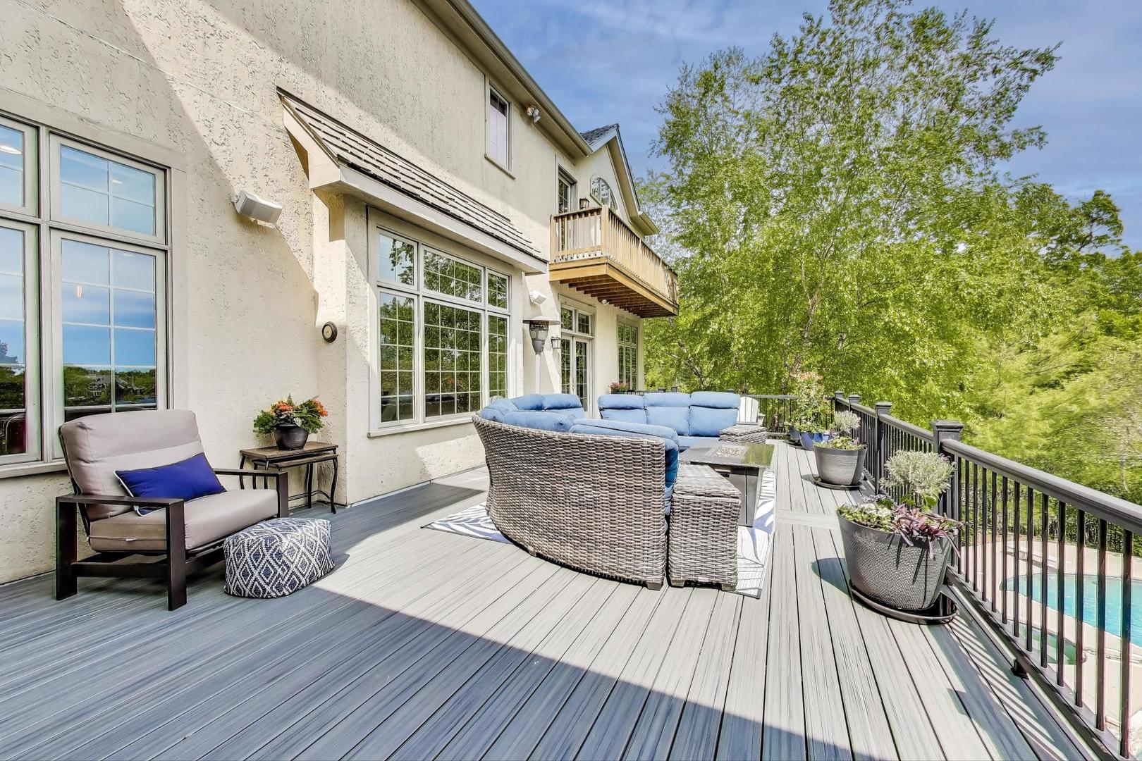 20580 West High Ridge Drive Kildeer, IL 60047 - Photo 57 of 69 a view of a deck with couches table and chairs and wooden floor