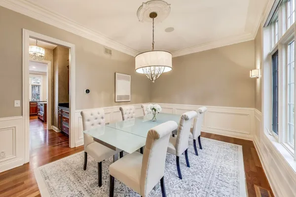 a kitchen with stainless steel appliances granite countertop a sink a stove and cabinets