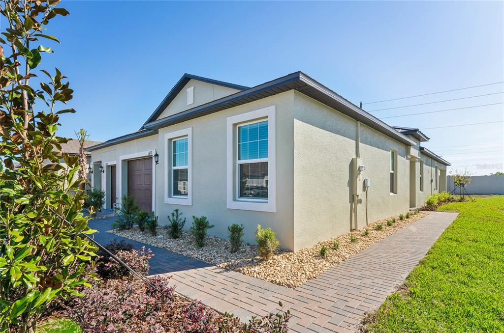 6692 Homebound Way New Port Richey, FL 34653 - Photo 44 of 47 a front view of house with yard outdoor seating and barbeque