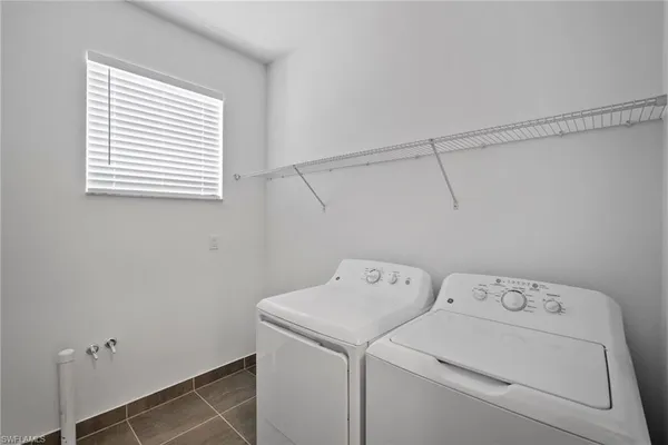 a bathroom with a sink a large mirror and a shower