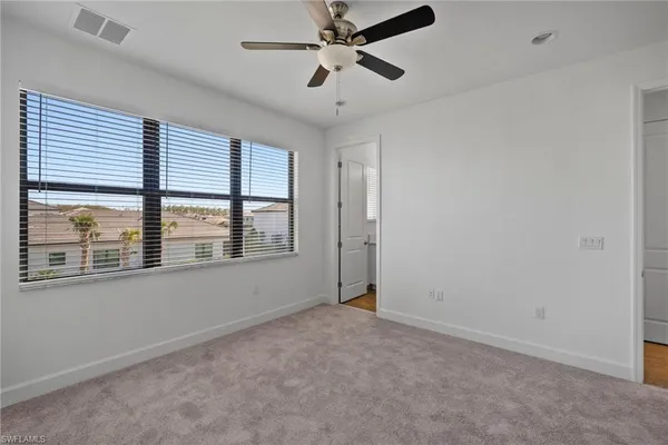 a bathroom with a sink toilet vanity and tub
