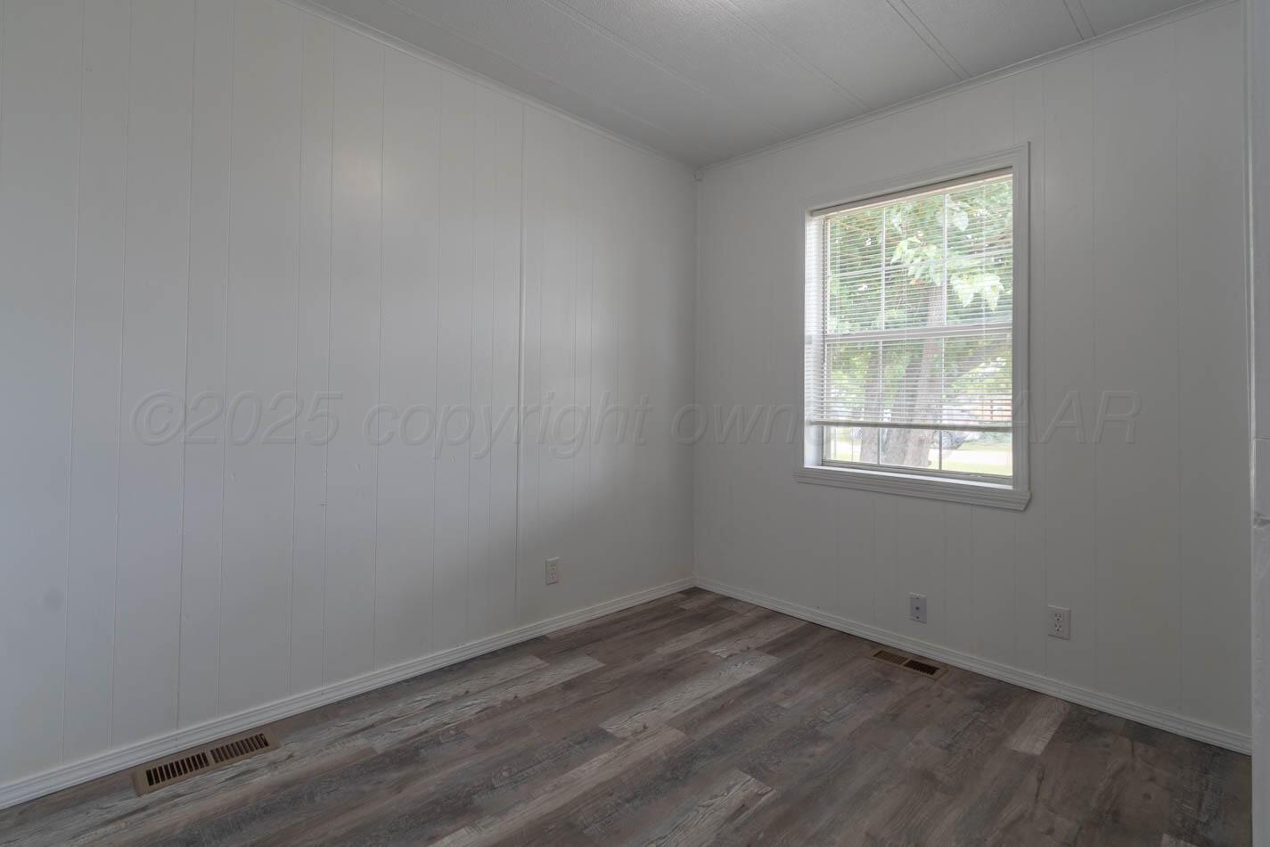 201 Michael Drive Fritch, TX 79036 - Photo 17 of 19 an empty room with a window