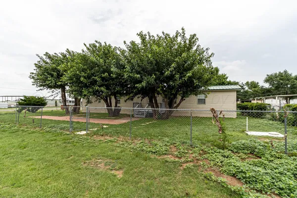 a view of backyard with green space