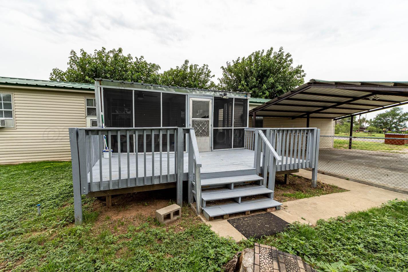 201 Michael Drive Fritch, TX 79036 - Photo 9 of 19 a view of backyard with deck and a garden