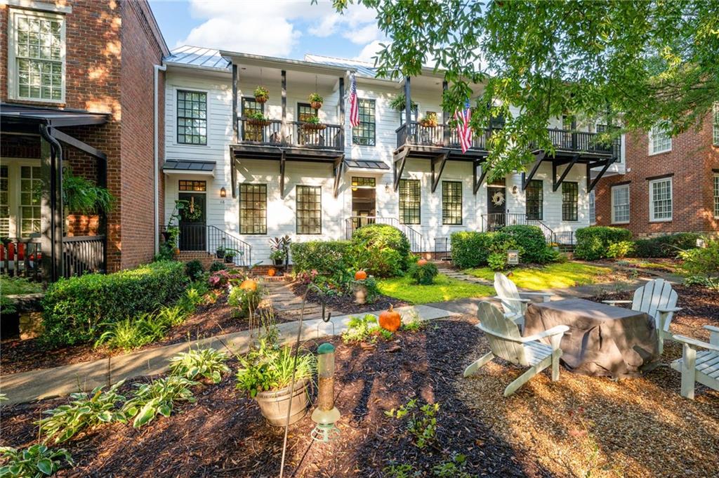 118 Hubbard Road Woodstock, GA 30188 - Photo 1 of 1 a front view of a building with garden and swimming pool
