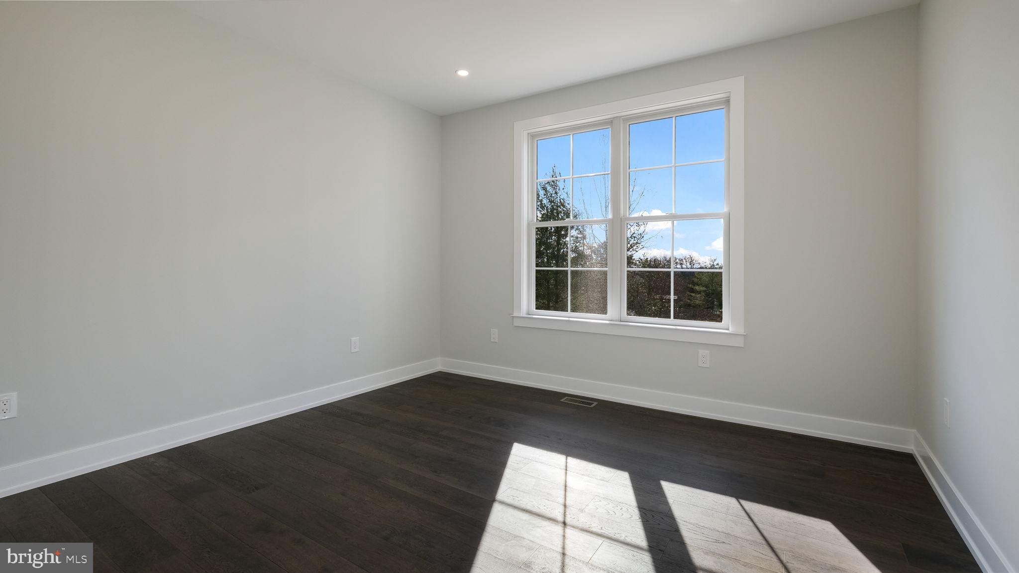2550 Rickert Road Perkasie, PA 18944 - Photo 26 of 73 a view of an empty room with wooden floor and a window
