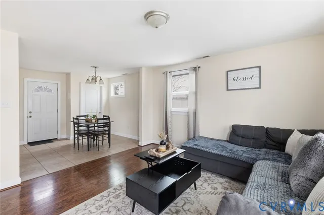 a living room with furniture and a table