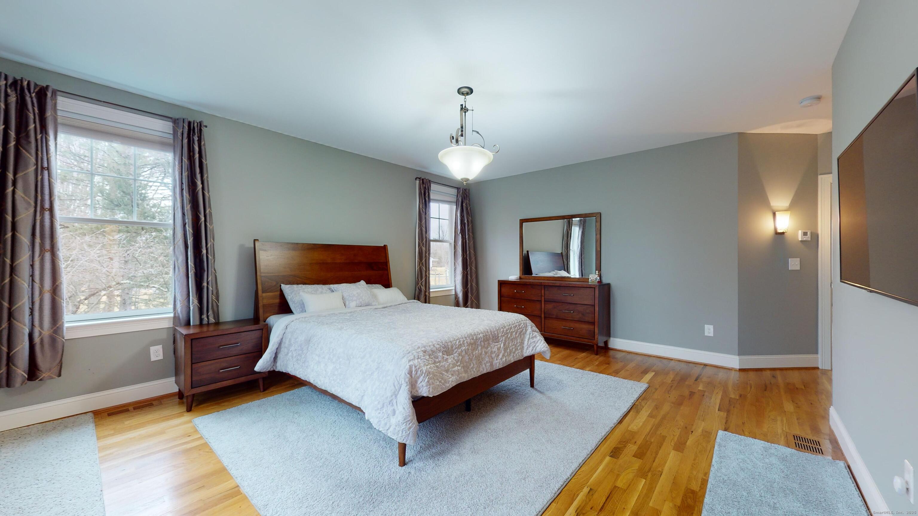 1012 Maple Street Rocky Hill, CT 06067 - Photo 13 of 31 a bedroom with a bed dresser and a window