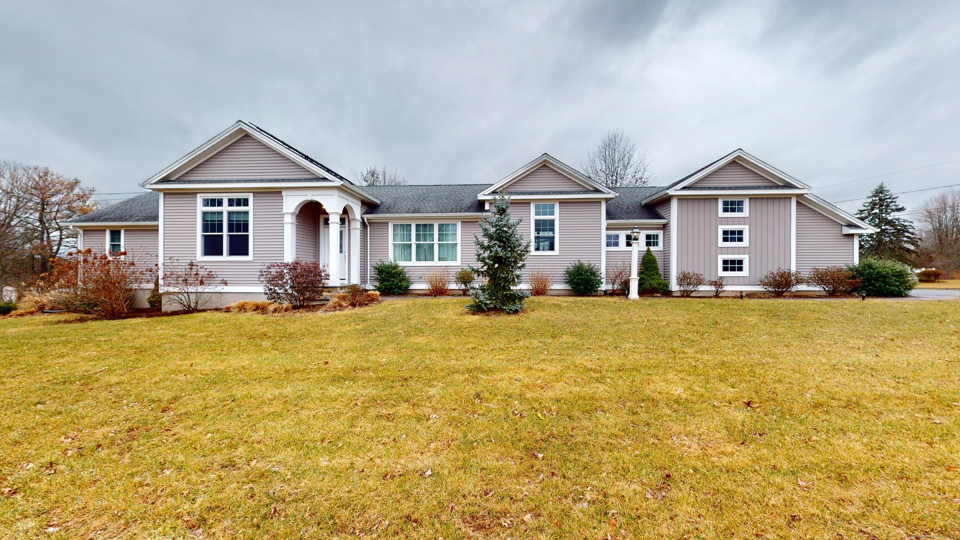 1012 Maple Street Rocky Hill, CT 06067 - Photo 27 of 31 a front view of house with yard and trees around
