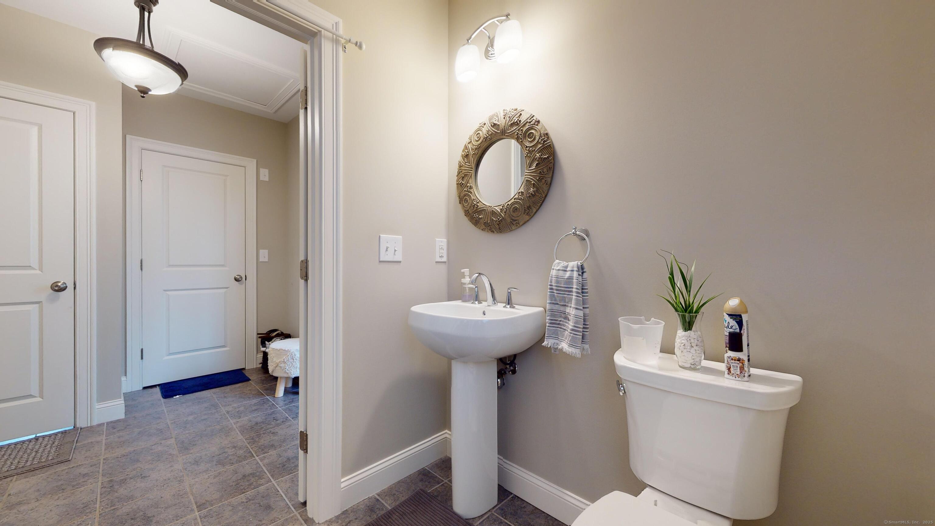 1012 Maple Street Rocky Hill, CT 06067 - Photo 10 of 31 a bathroom with a sink and a mirror