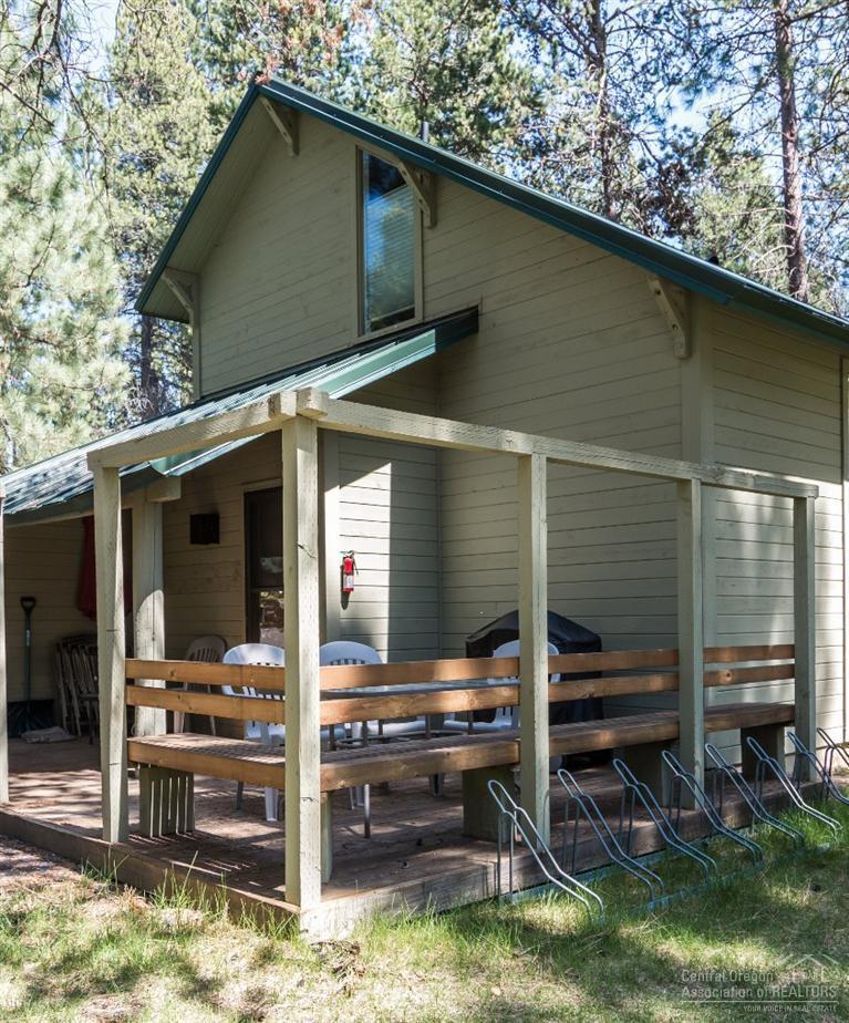 17 Ranch Cabin Road Sunriver, OR 97707 - Photo 10 of 23 a backyard of a house with barbeque oven table and chairs