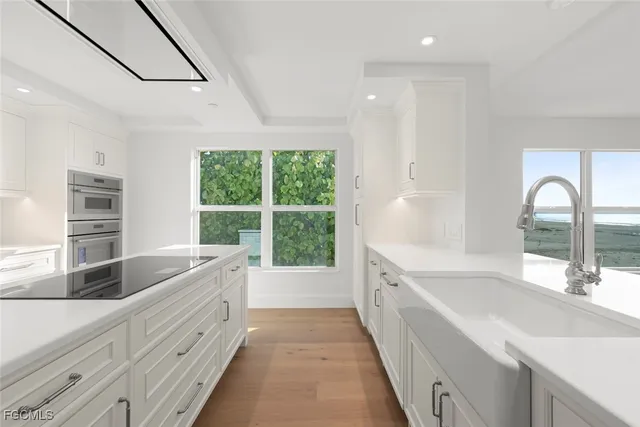 a kitchen with granite countertop a sink and a window