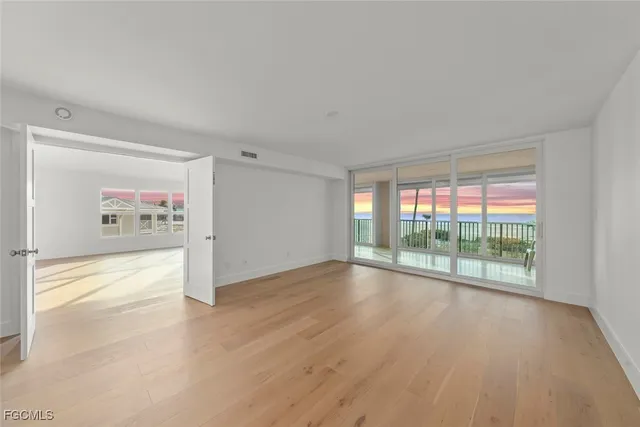 a spacious bedroom with a large bed and a couch