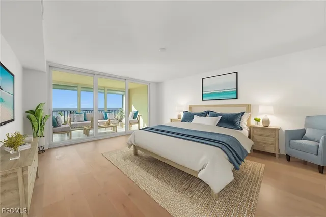 a spacious bedroom with a bed and a couch