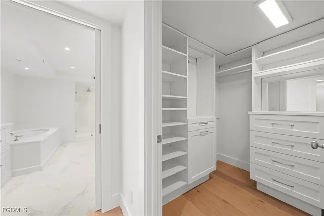 a view of closet area with empty racks