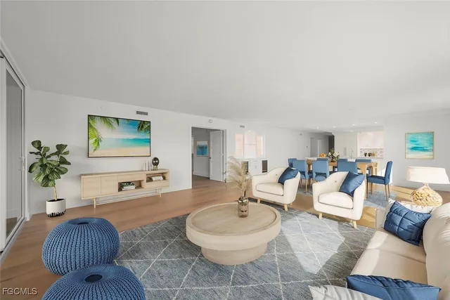 a large white kitchen with a large window