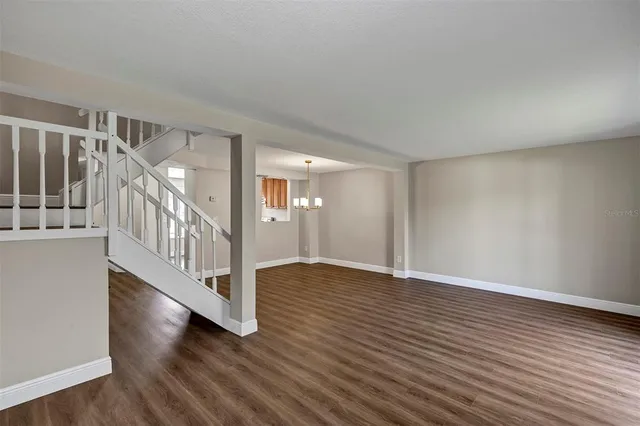 a view of an entryway with wooden floor