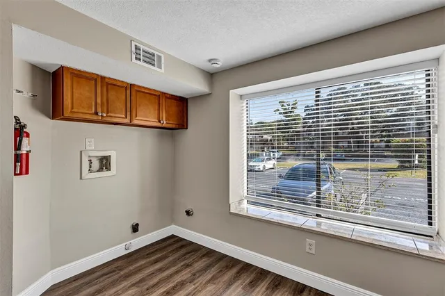 a view of a door and a window