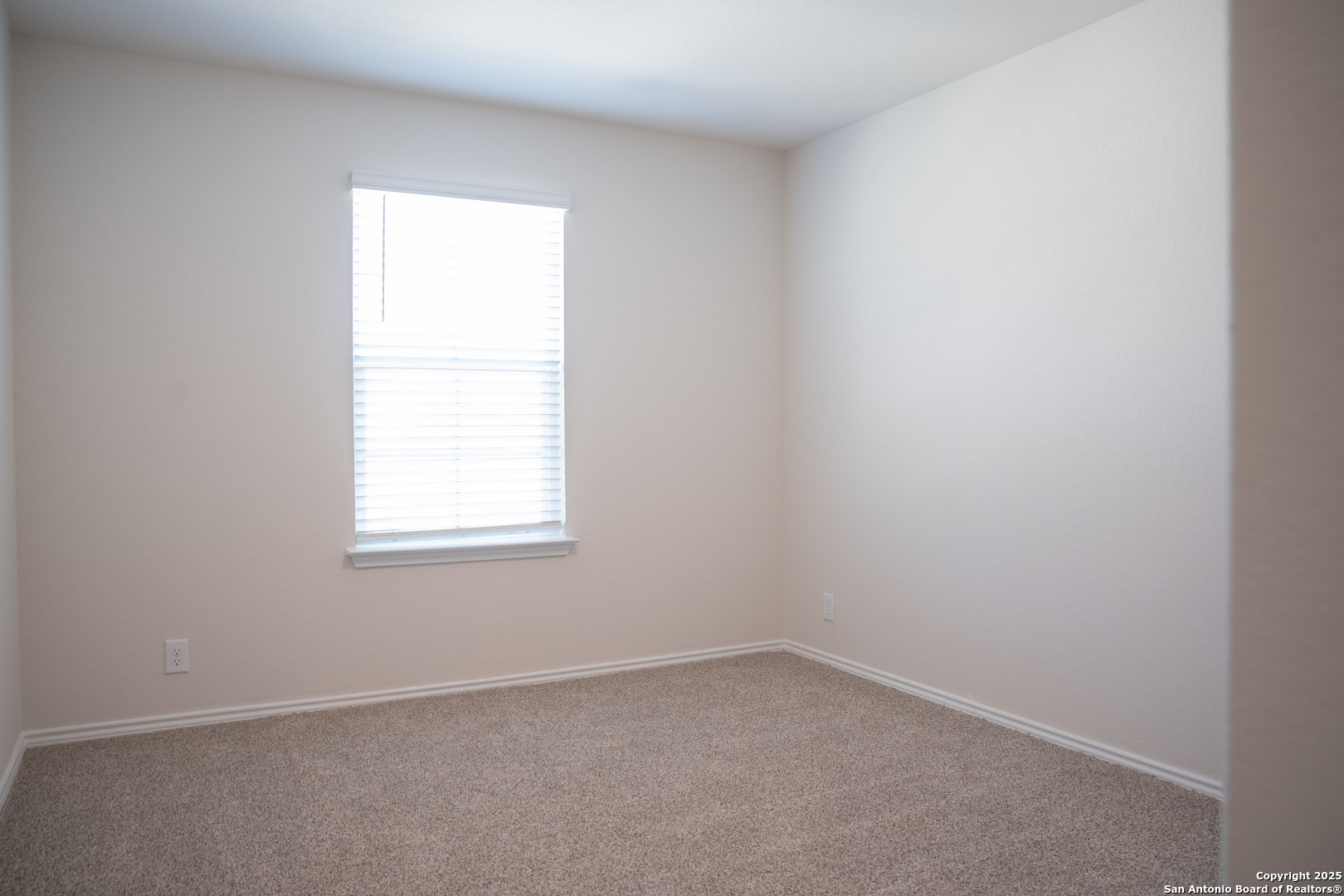 5903 Cosmic Crisp San Antonio, TX 78252 - Photo 13 of 20 an empty room with a window