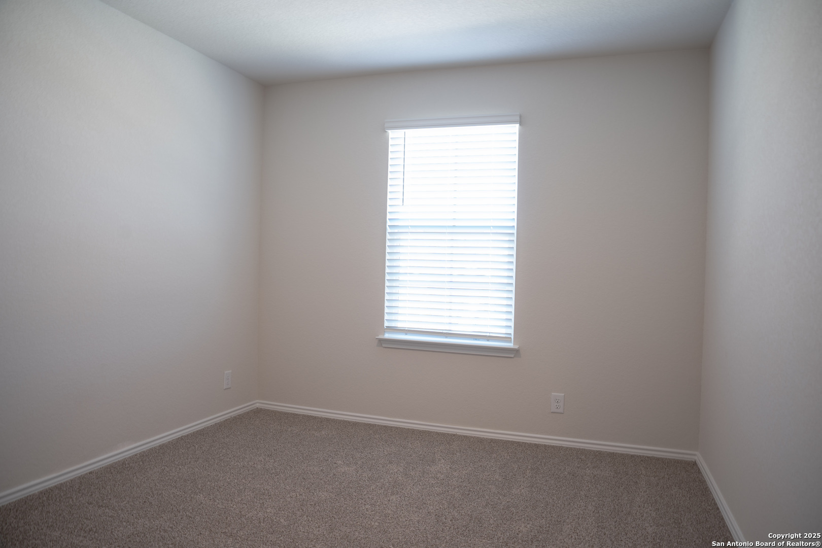 5903 Cosmic Crisp San Antonio, TX 78252 - Photo 15 of 20 an empty room with a window