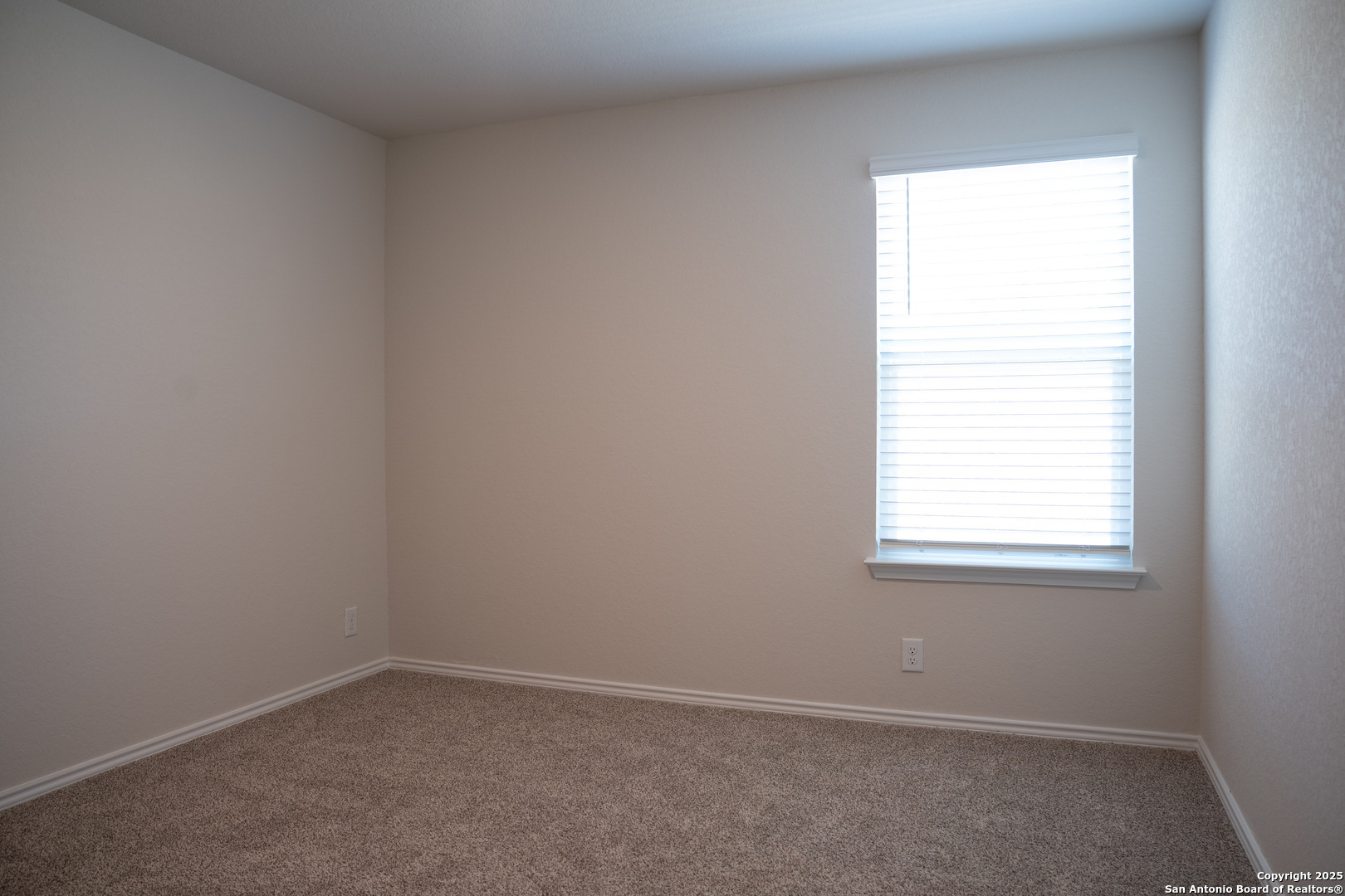 5903 Cosmic Crisp San Antonio, TX 78252 - Photo 16 of 20 an empty room with a window