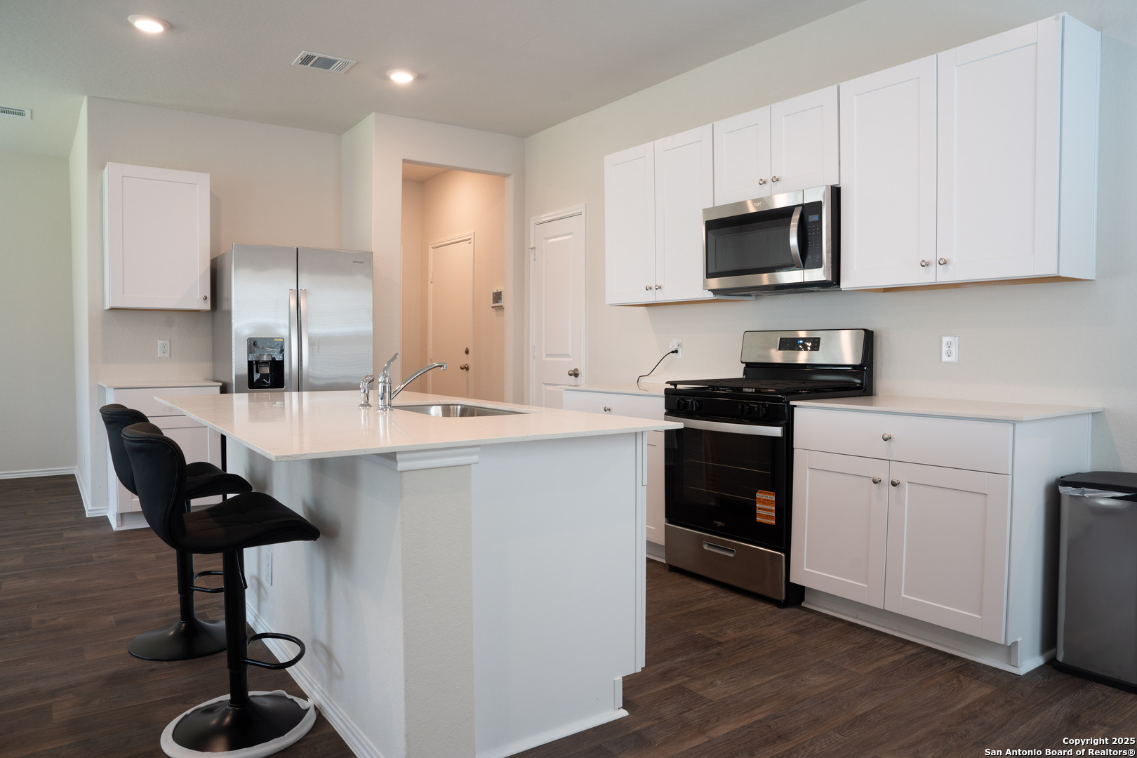 5903 Cosmic Crisp San Antonio, TX 78252 - Photo 3 of 20 a kitchen with appliances a sink and cabinets