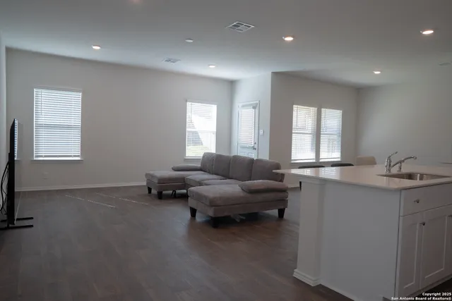 a living room with furniture and window