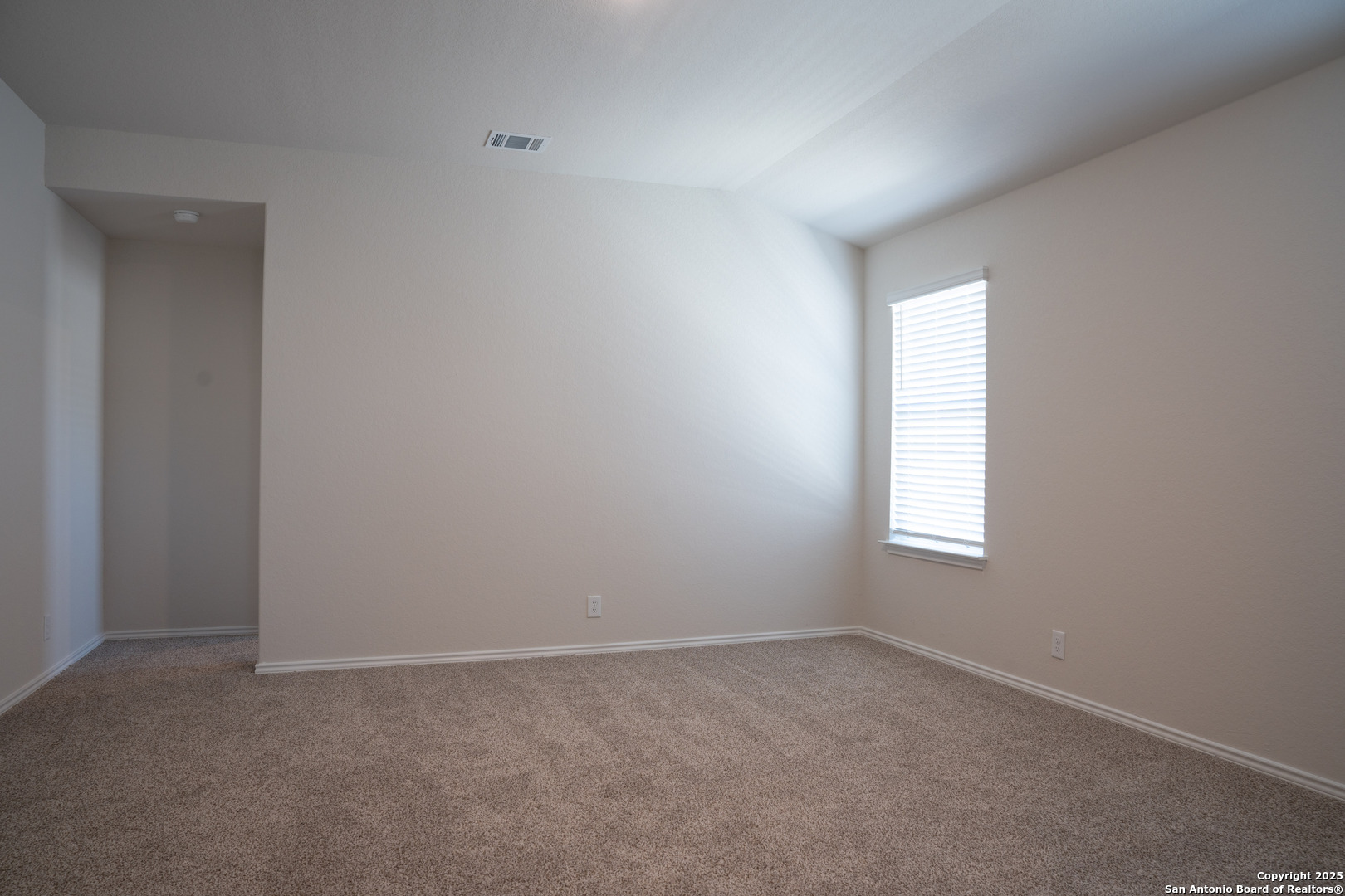 5903 Cosmic Crisp San Antonio, TX 78252 - Photo 9 of 20 an empty room with a window