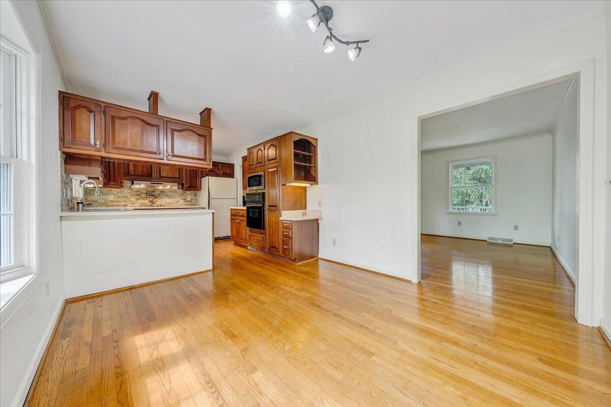 3534 Wedgewood Road Southwest Roanoke, VA 24018 - Photo 11 of 53 a view of a kitchen with furniture and wooden floor