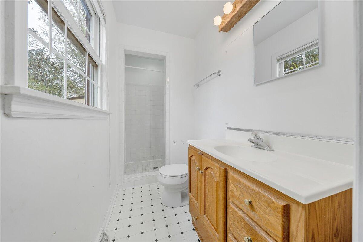 3534 Wedgewood Road Southwest Roanoke, VA 24018 - Photo 18 of 53 a bathroom with a sink a toilet and a window