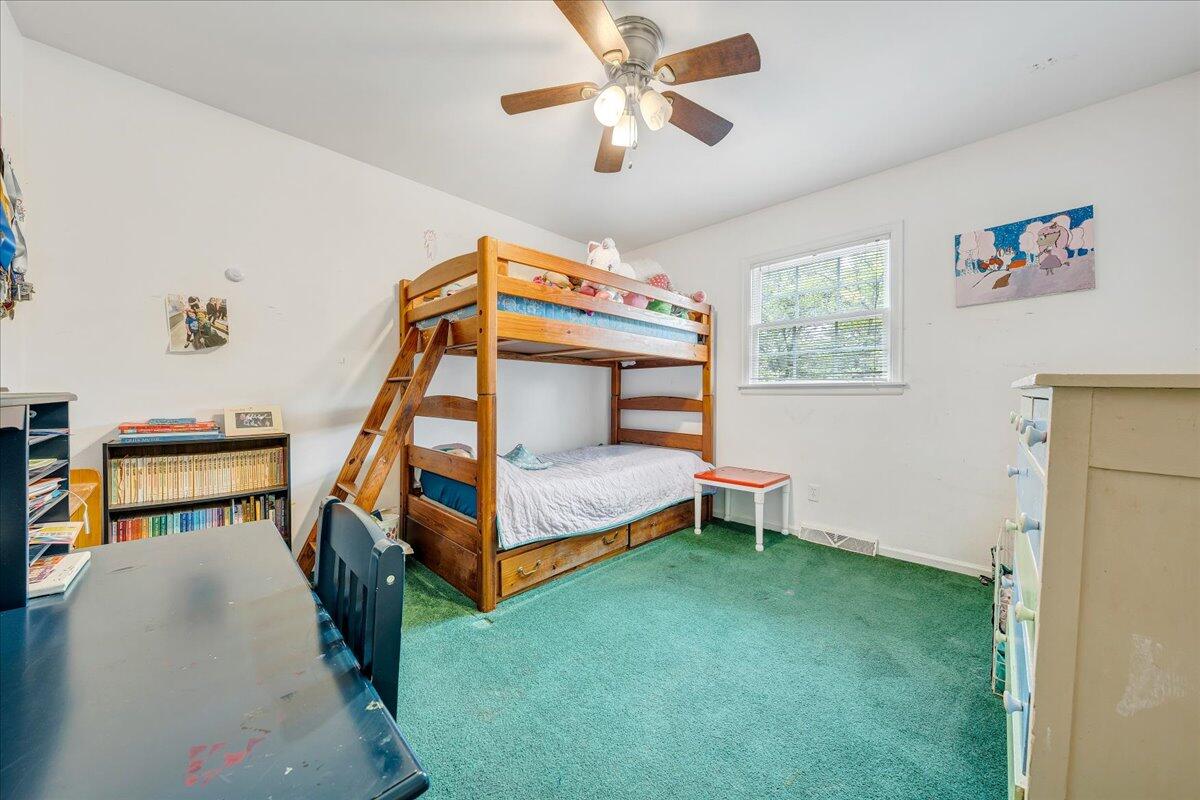 3534 Wedgewood Road Southwest Roanoke, VA 24018 - Photo 19 of 53 a bedroom with a bed and a chandelier