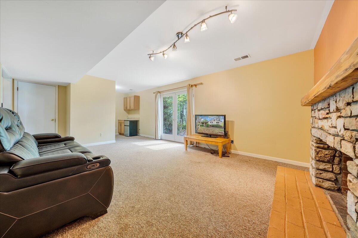 3534 Wedgewood Road Southwest Roanoke, VA 24018 - Photo 27 of 53 a living room with furniture and a flat screen tv