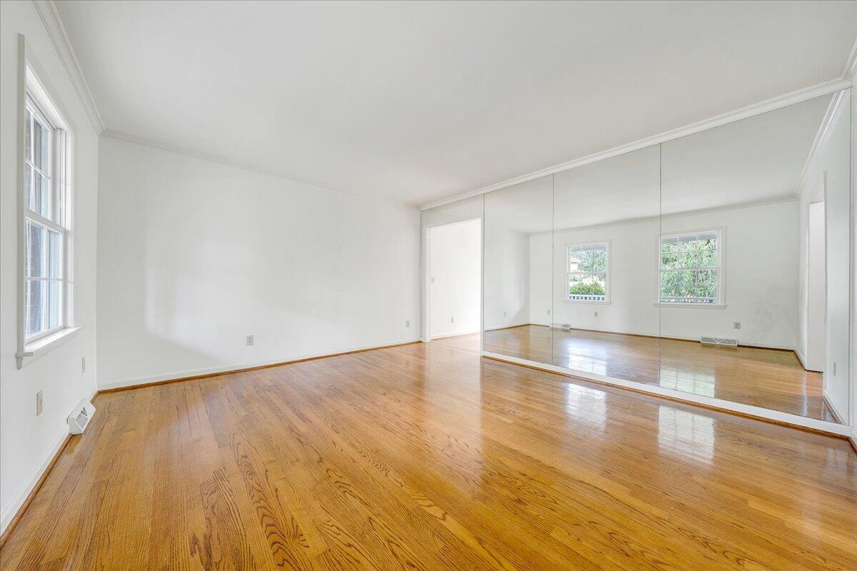 3534 Wedgewood Road Southwest Roanoke, VA 24018 - Photo 7 of 53 an empty room with wooden floor and windows