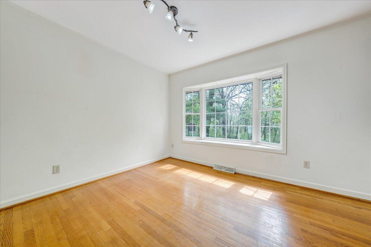 3534 Wedgewood Road Southwest Roanoke, VA 24018 - Photo 9 of 53 a view of an empty room with wooden floor and a window