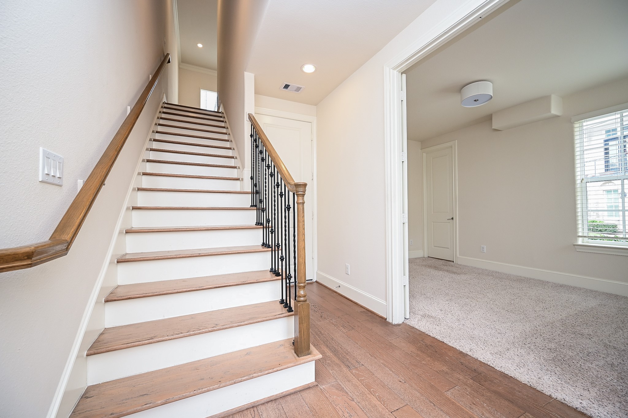 9546 London Bridge Station Houston, TX 77045 - Photo 10 of 41 The grand entry staircase on the first level shares its entrance walkway with a stunning front room.