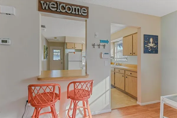 a view of kitchen with cabinets