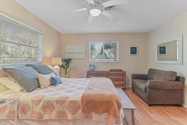 a bedroom with a bed and a couch