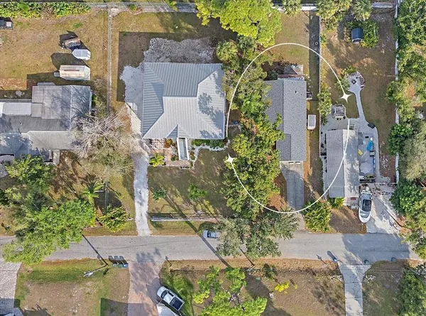 an aerial view of residential houses with outdoor space