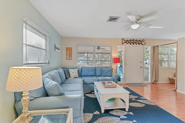 a living room with furniture and a window