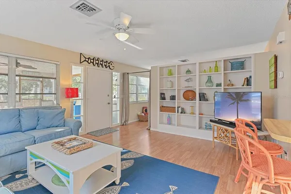a view of a livingroom with furniture and wooden floor