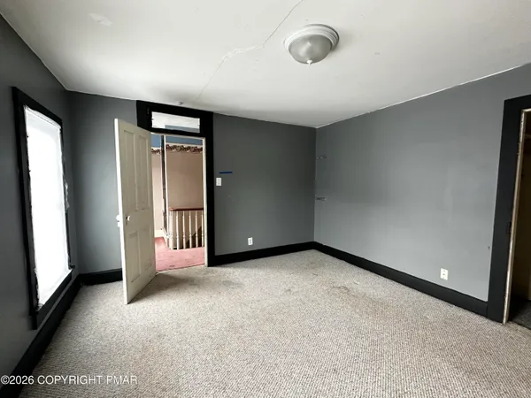 an empty room with windows