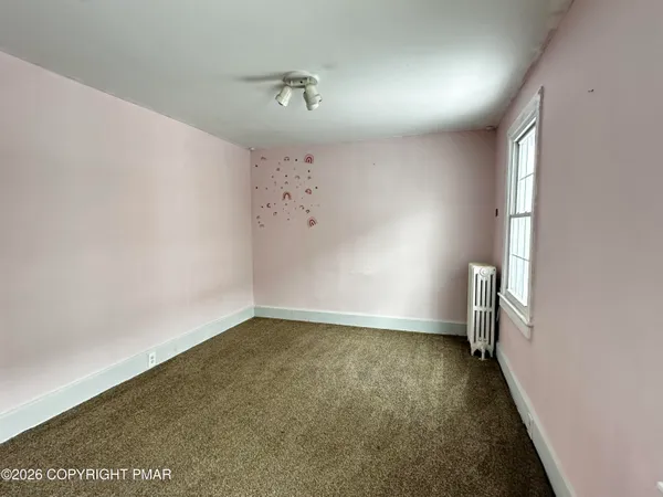 an empty room with a empty space and window