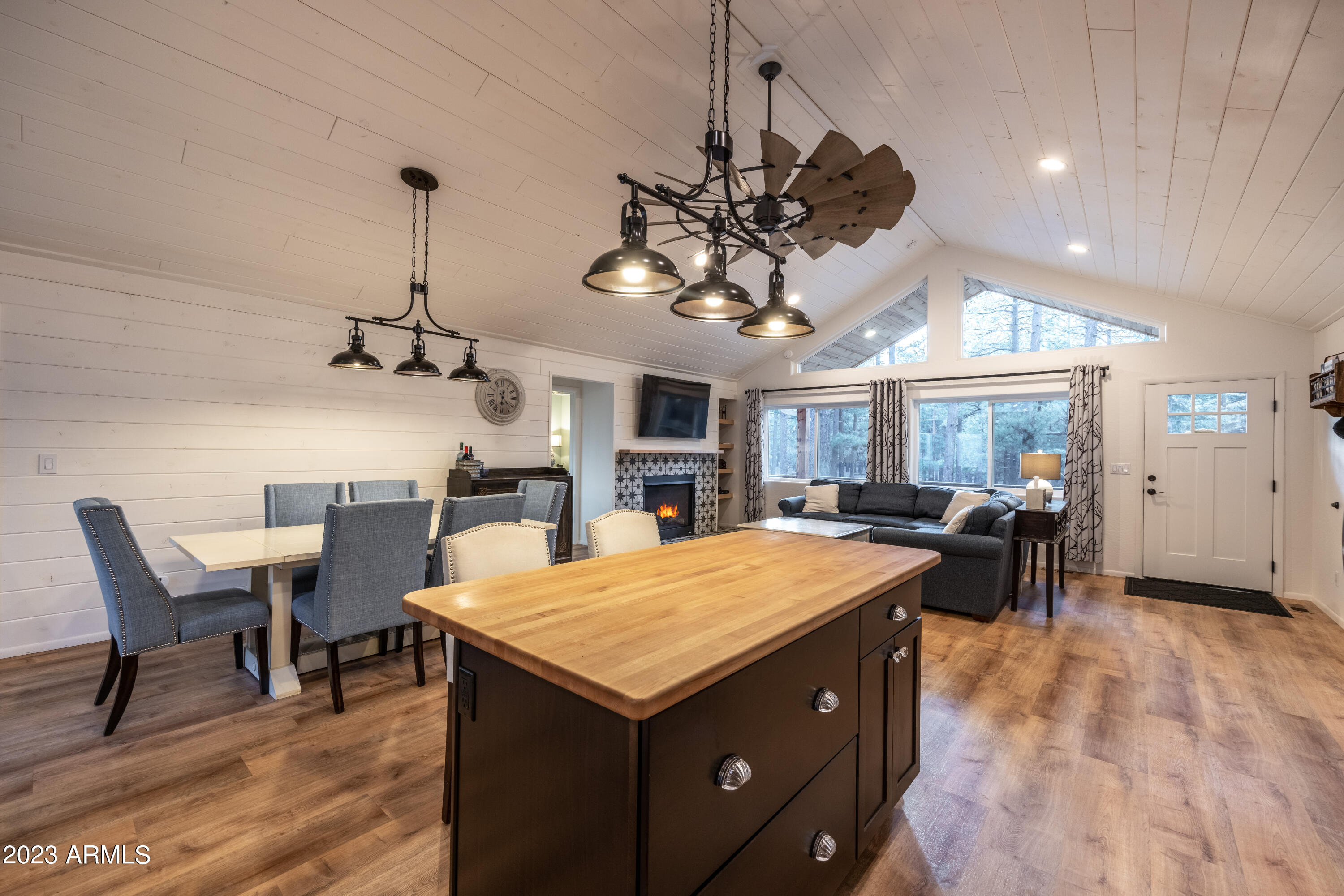 2772 Larson Loop Forest Lakes, AZ 85931 - Photo 14 of 65 an open kitchen with a table and chairs