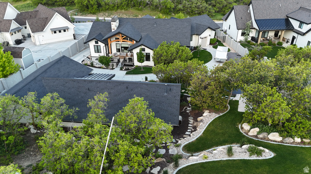 3167 South Mapleton Estates Drive Mapleton, UT 84664 - Photo 39 of 42 Expansive estate featuring a large main residence, manicured lawns, mature landscaping, a secondary structure with a dark roof, and a paved driveway
