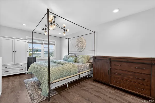 a bedroom with two beds and a desk