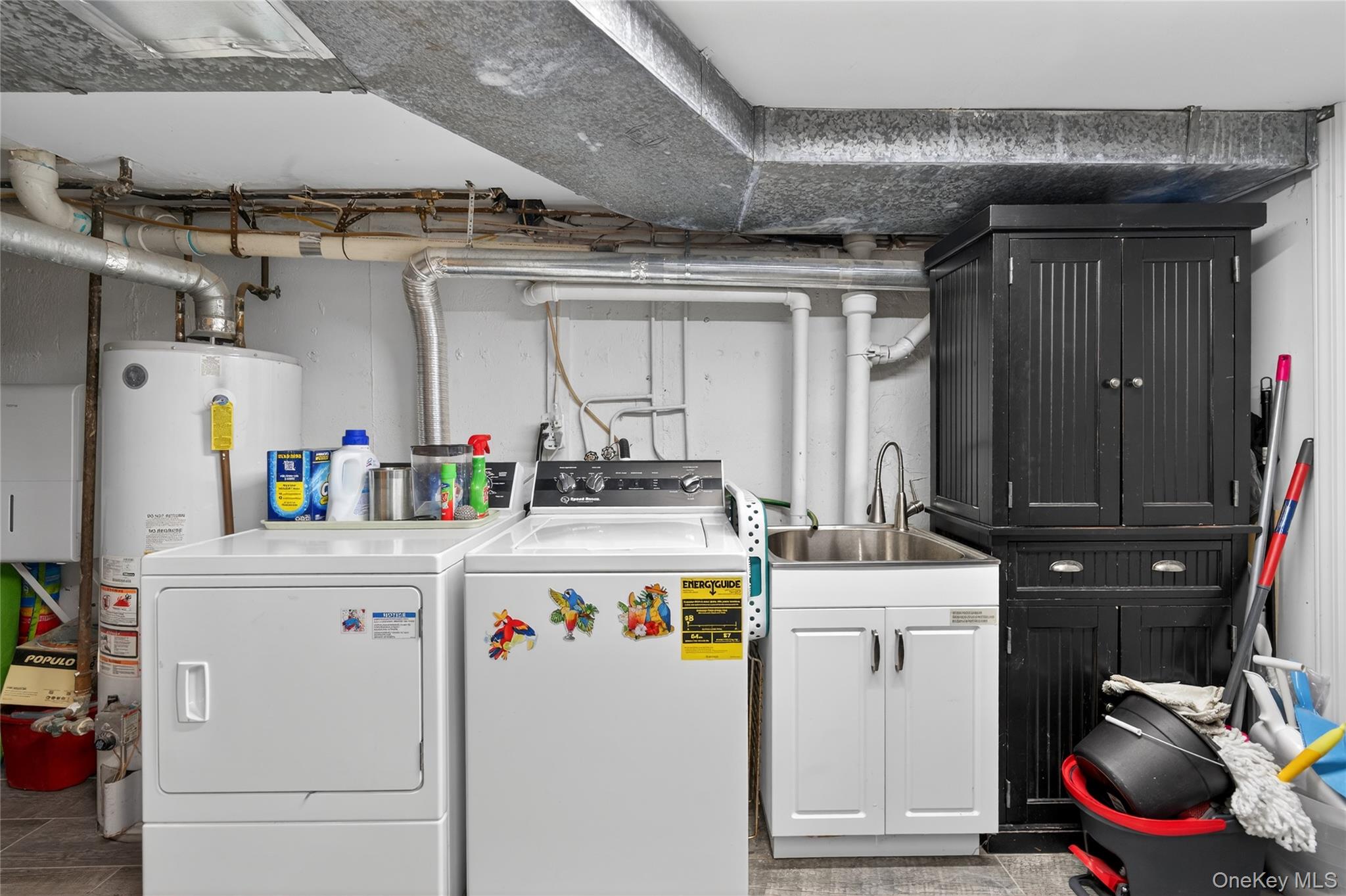 3530 Long Beach Road, Unit 8 Oceanside, NY 11572 - Photo 16 of 19 a utility room with dryer and washer