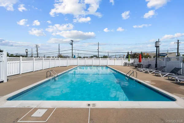 a view of a balcony with lake view and a potted plant