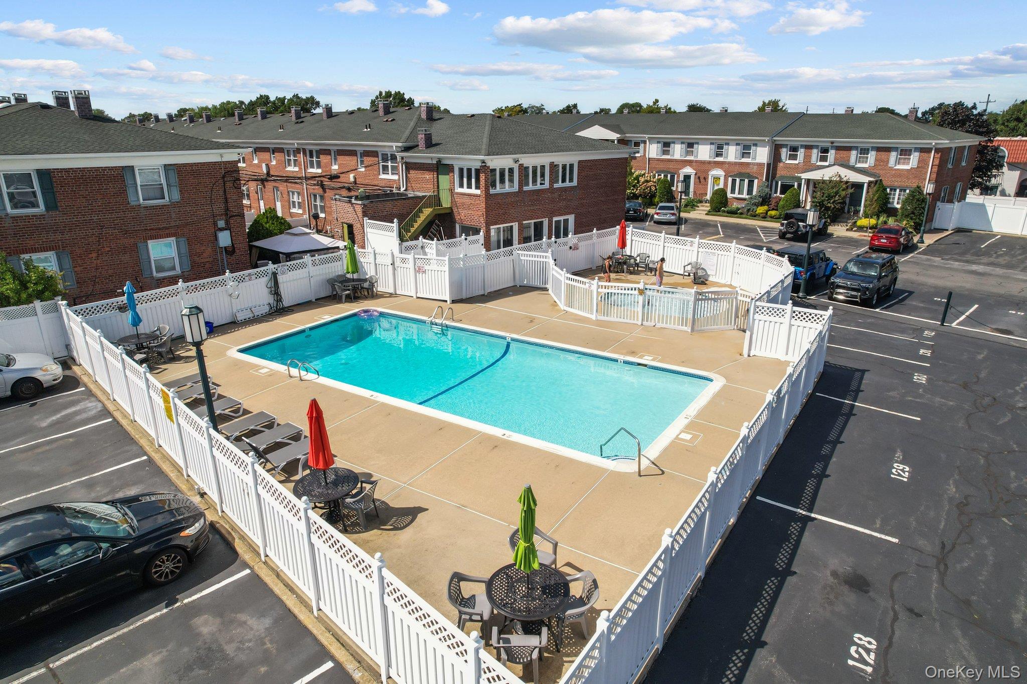 3530 Long Beach Road, Unit 8 Oceanside, NY 11572 - Photo 18 of 19 a view of a balcony with lake view and a potted plant
