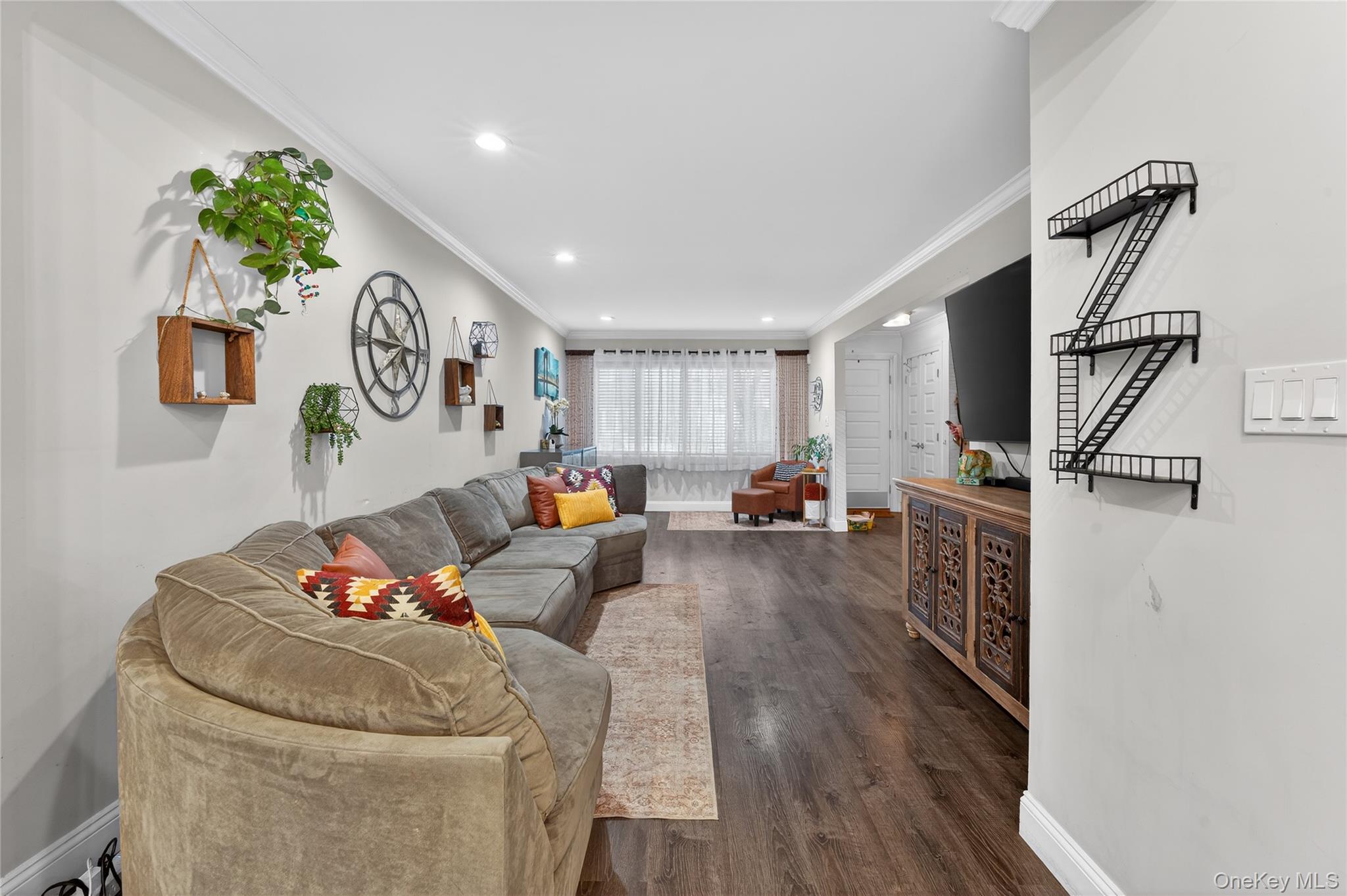 3530 Long Beach Road, Unit 8 Oceanside, NY 11572 - Photo 3 of 19 a living room with furniture and a flat screen tv